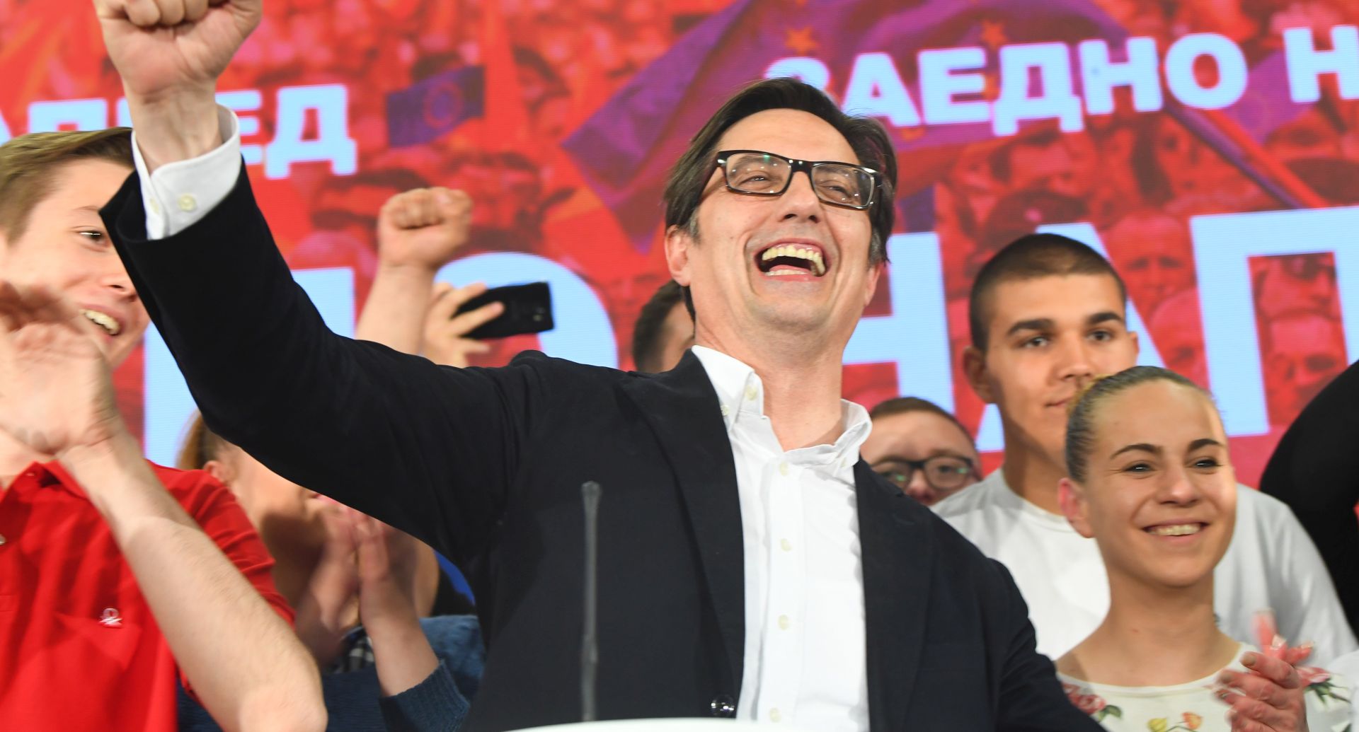 epa07549908  Stevo Pendarovski (C), the candidate of the ruling Social Democratic Union of Macedonia (SDSM) celebrates with supporters after declaring election victory in Skopje, North Macedonia, 05 May 2019. More than 1.8 million voters were leigible to choose between two candidates for the President of North Macedonia in the second round of elections.  EPA/GEORGI LICOVSKI