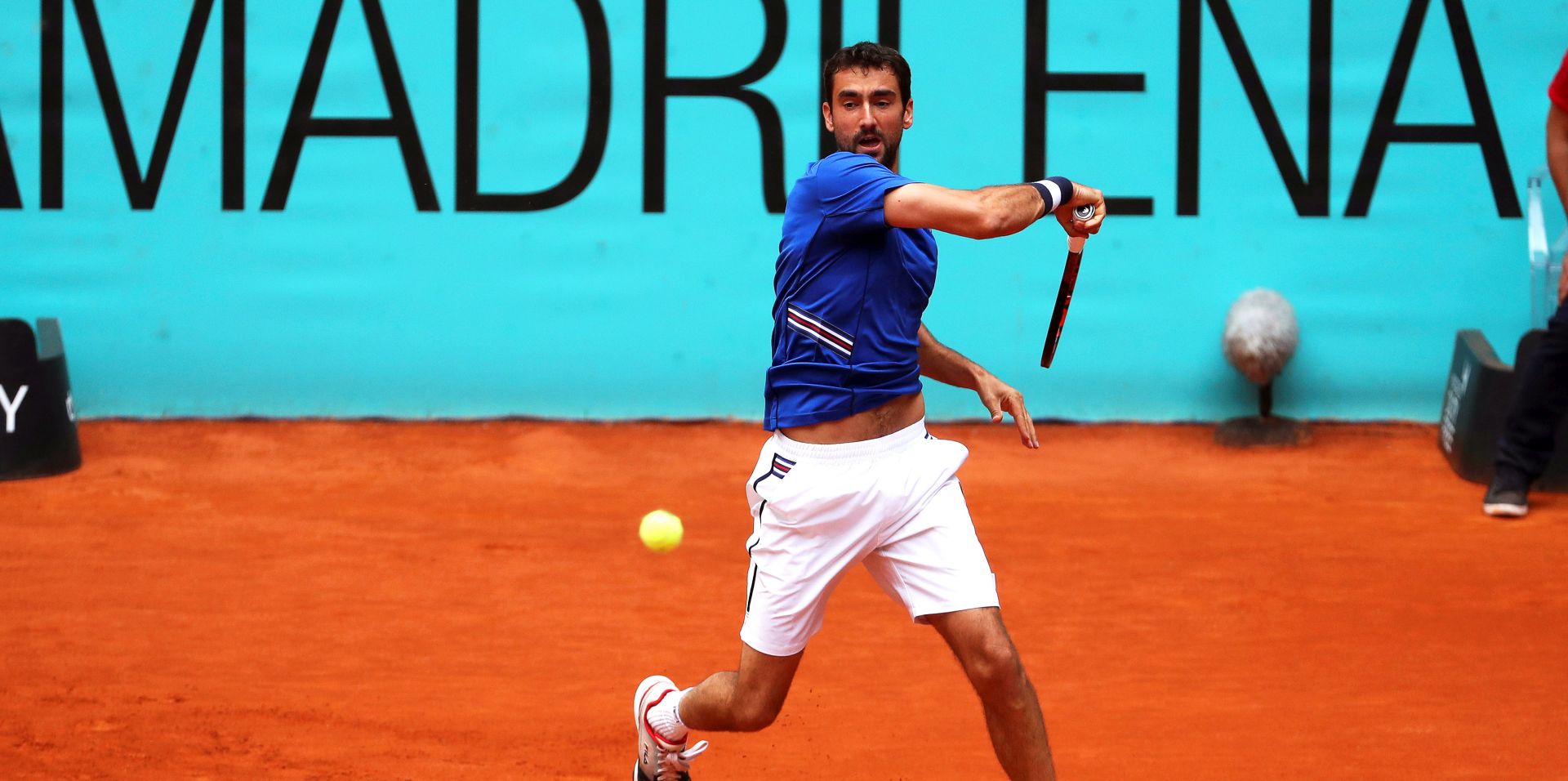 epa07551396 Marin Cilic of Croatia in action against Martin Klizan of Slovakia during their first round match of the Mutua Madrid Open tennis tournament at the Caja Magica complex in Madrid, Spain, 06 May 2019.  EPA/KIKO HUESCA