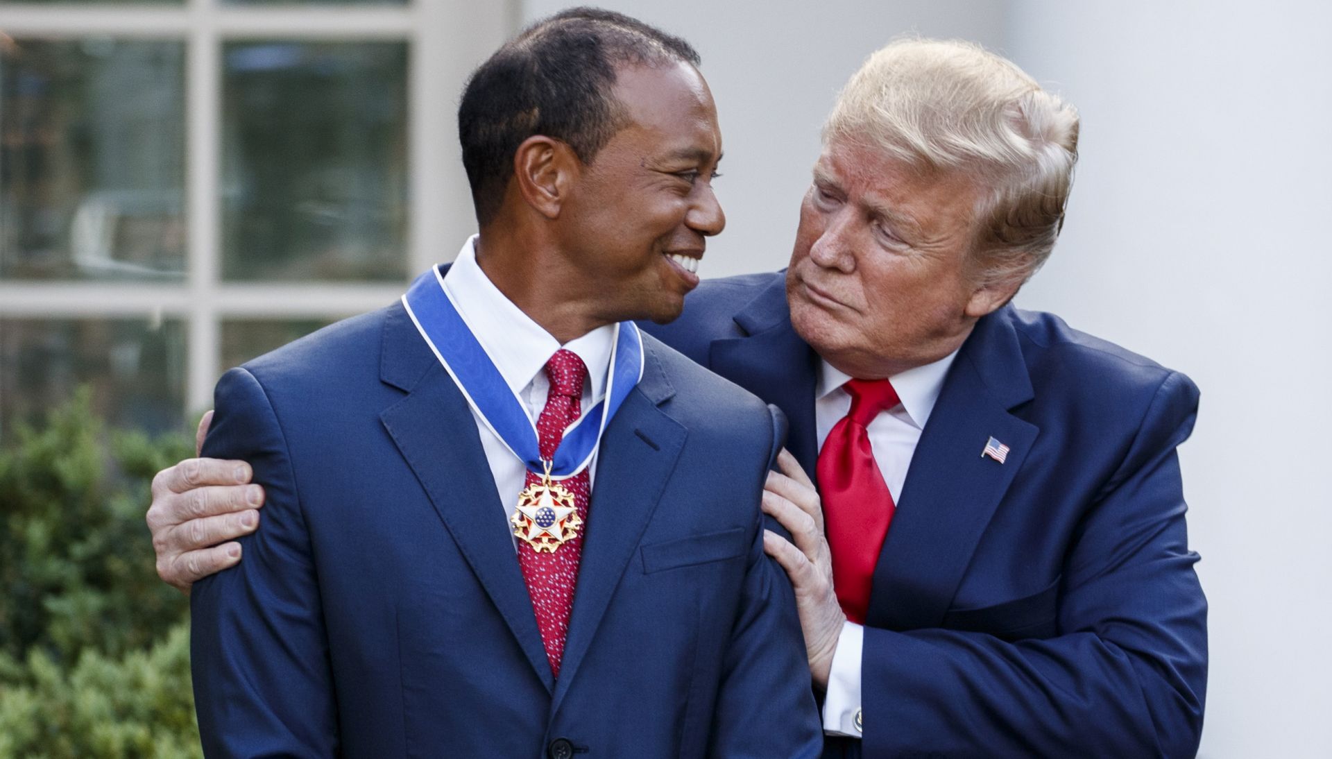 epaselect epa07552091 US President Donald J. Trump (R) awards golfer Tiger Woods (L) the Presidential Medal of Freedom during a ceremony in the Rose Garden of the White House in Washington, DC, USA, 06 May 2019. After winning the Masters President Trump tweeted that he would award Woods the Presidential Medal of Freedom.  EPA/SHAWN THEW