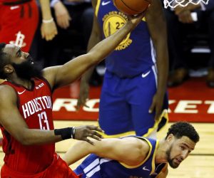 epa07552648 Houston Rockets guard James Harden (L) lays the ball in for two points during the NBA Western Conference playoff semifinal game four between the Golden State Warriors and the Houston Rockets at Toyota Center in Houston, Texas, USA, 06 May 2019.  EPA/AARON M. SPRECHER  SHUTTERSTOCK OUT