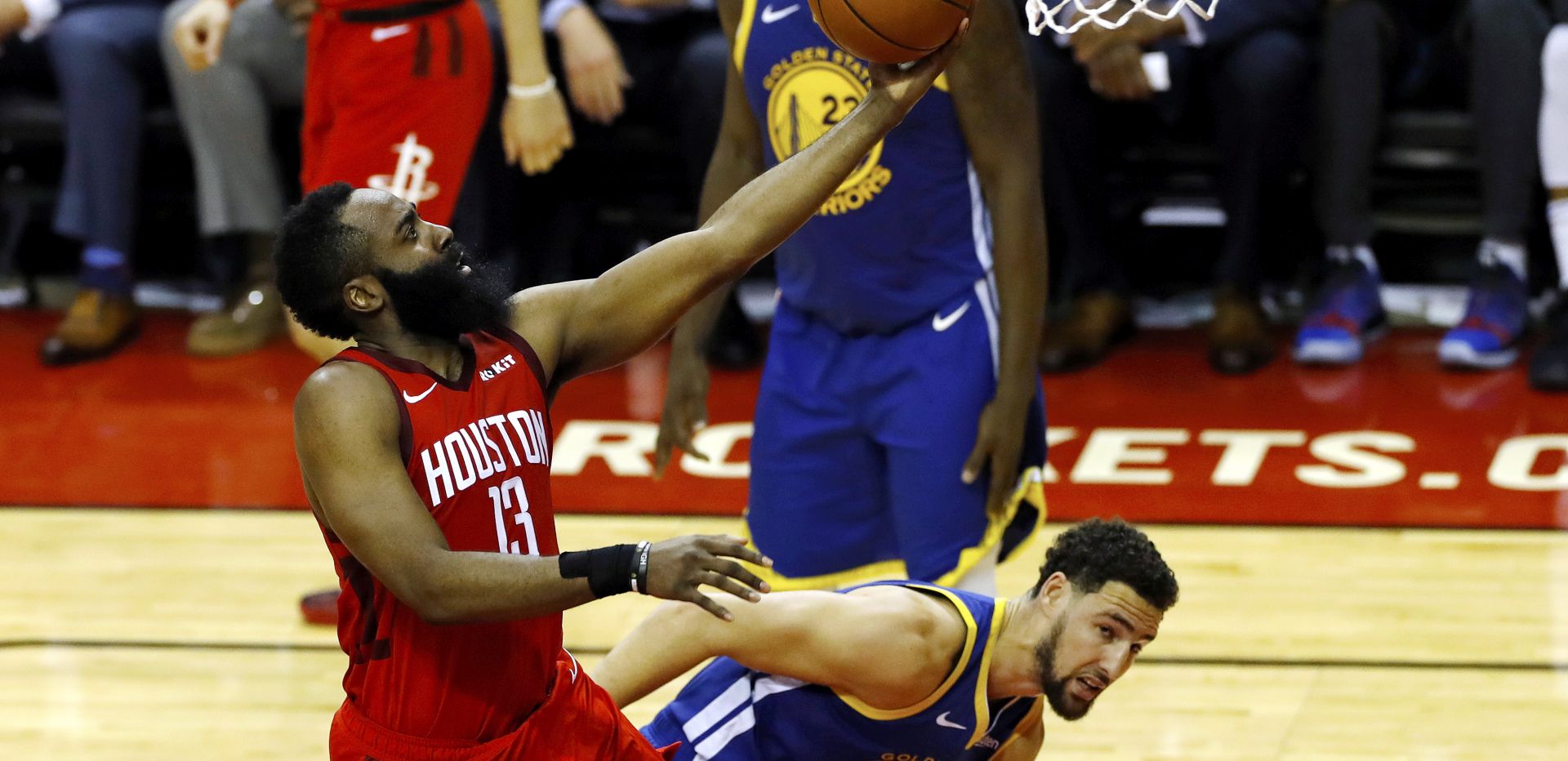 epa07552648 Houston Rockets guard James Harden (L) lays the ball in for two points during the NBA Western Conference playoff semifinal game four between the Golden State Warriors and the Houston Rockets at Toyota Center in Houston, Texas, USA, 06 May 2019.  EPA/AARON M. SPRECHER  SHUTTERSTOCK OUT