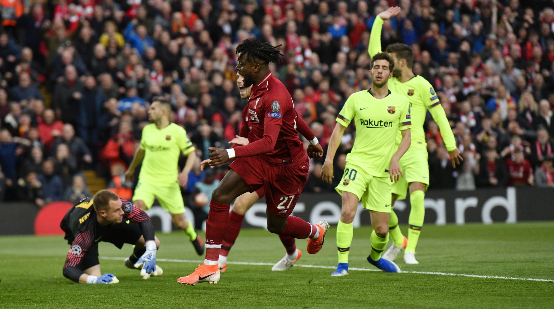 epa07554424 Divock Origi (C) of Liverpool scores the opening goal during the UEFA Champions League semi final 2nd leg match between Liverpool FC and FC Barcelona at Anfield, Liverpool, Britain, 07 May 2019.  EPA/NEIL HALL