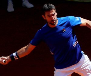 epa07557707 Marin Cilic of Croatia in action against Laslo Djere of Serbia during their third round match of the Mutua Madrid Open tennis tournament at the Caja Magica complex in Madrid, Spain, 09 May 2019.  EPA/CHEMA MOYA