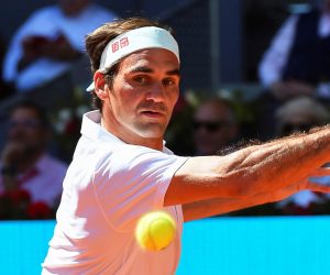 epa07558399 Roger Federer of Switzerland in action against Gael Monfils of France during their third round match of the Mutua Madrid Open tennis tournament at the Caja Magica complex in Madrid, Spain, 09 May 2019.  EPA/FERNANDO VILLAR