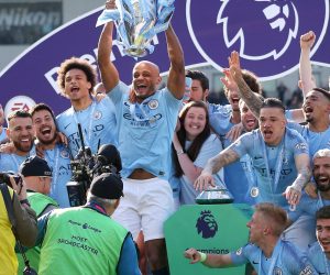 epa07565177 Manchester City captain Vincent Kompany lifts the trophy as the team celebrate after the English Premier League match between Brighton and Hove Albion and Manchester City, Brighton, Britain, 12 May 2019. Manchester City won 4-1 and won the Premier League title.  EPA/JAMES BOARDMAN EDITORIAL USE ONLY.  No use with unauthorized audio, video, data, fixture lists, club/league logos or 'live' services. Online in-match use limited to 120 images, no video emulation. No use in betting, games or single club/league/player publications.