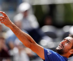 epa07569883 Marin Cilic of Croatia in action against Andrea Basso of Italy during their men's singles first round match at the Italian Open tennis tournament in Rome, Italy, 14 May 2019.  EPA/RICCARDO ANTIMIANI