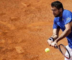 epa07569878 Marin Cilic of Croatia in action against Andrea Basso of Italy during their men's singles first round match at the Italian Open tennis tournament in Rome, Italy, 14 May 2019.  EPA/RICCARDO ANTIMIANI