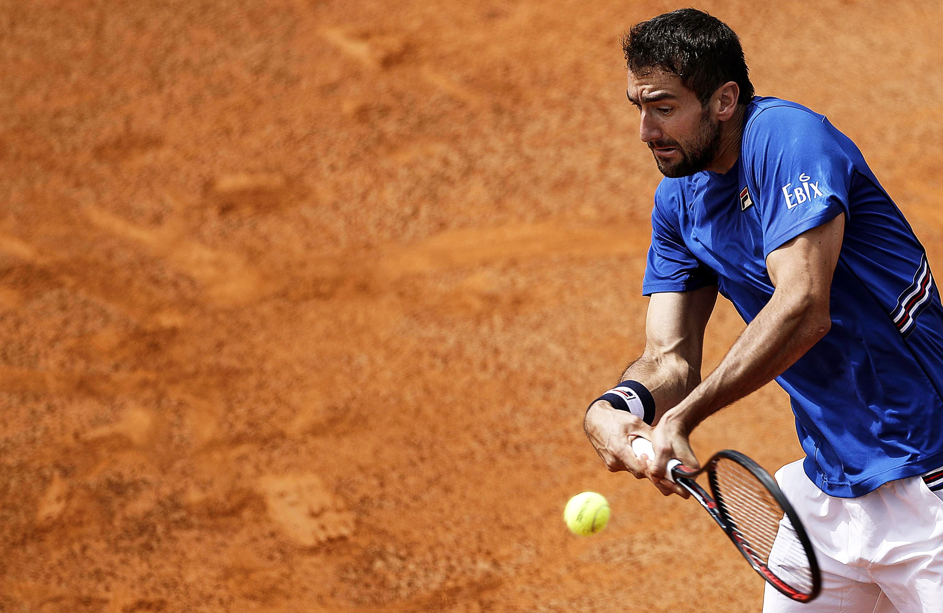 epa07569878 Marin Cilic of Croatia in action against Andrea Basso of Italy during their men's singles first round match at the Italian Open tennis tournament in Rome, Italy, 14 May 2019.  EPA/RICCARDO ANTIMIANI