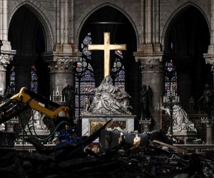 epa07572825 A picture shows rubble and the cross at the altar inside the the Notre Dame de Paris Cathedral after it sustained major fire damage the previous month, during a visit by the Canadian prime minister in Paris France, 15 May 2019. On 15 April, fire destroyed the roof and steeple of the 850-year-old Gothic cathedral. Images of the ancient cathedral going up in flames sparked shock and dismay across the globe as well as in France, where it is considered one of the nation's most beloved landmarks.  EPA/PHILIPPE LOPEZ  MAXPPP OUT