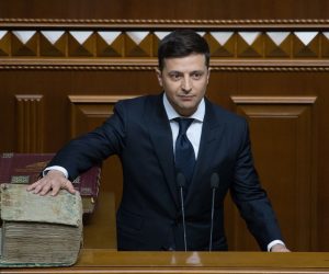 epa07586231 A handout photo made available by the Presidential Press Service on 20 May 2019 shows President-elect Volodymyr Zelensky reads an oath putting his hand on the Holy Bible during his inauguration in the Ukrainian parliament in Kiev, Ukraine, 20 May 2019. Volodymyr Zelensky with 73,22 percent of the votes beats out the current President Petro Poroshenko, who received 24,45 percent of the votes during the second tour of Presidential elections in Ukraine which was held on 21 April 2019.  EPA/MYKHAILO MARKIV/ PPS HANDOUT  HANDOUT EDITORIAL USE ONLY/NO SALES