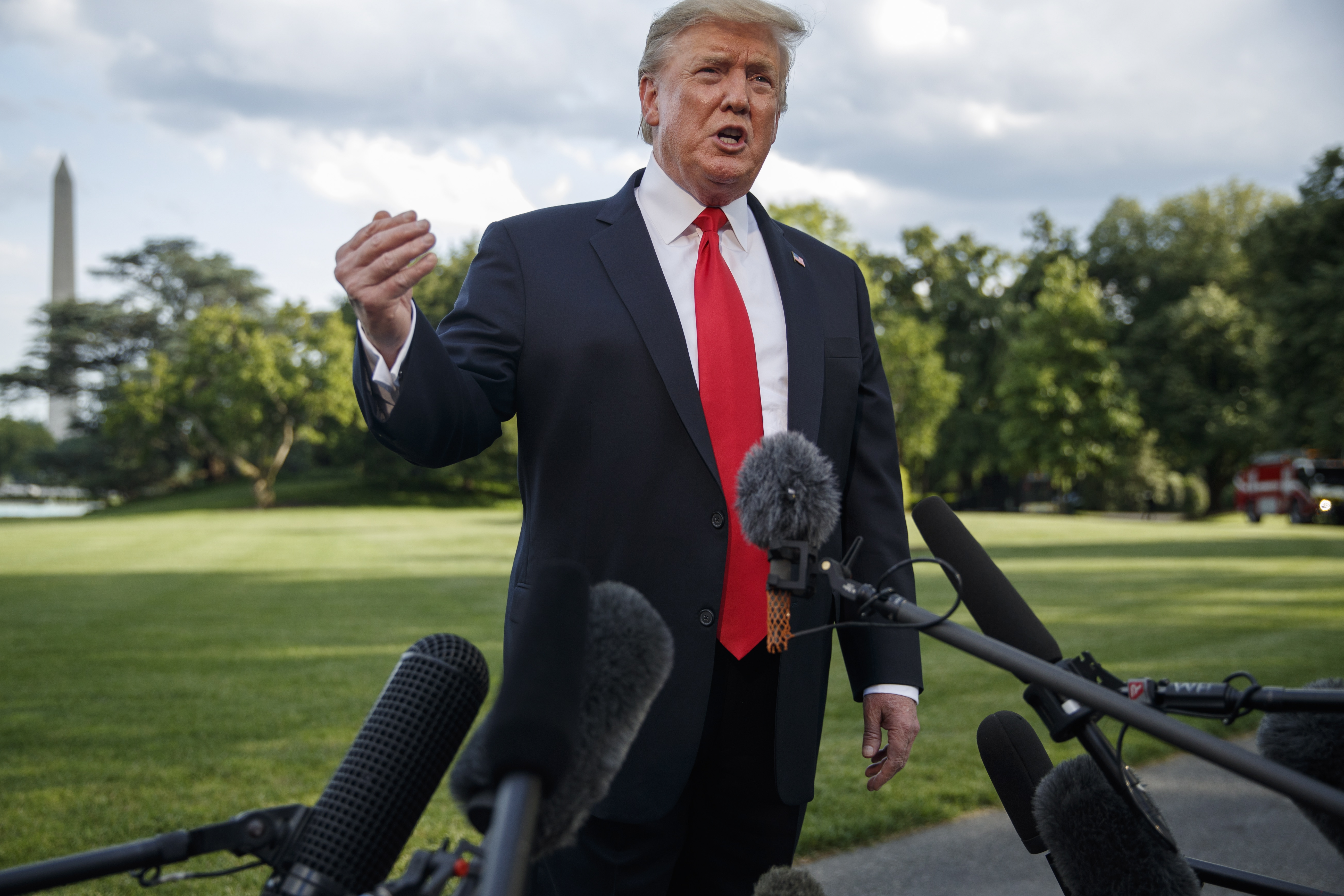 epa07588039 US President Donald J. Trump responds to a question from the news media as he walks to board Marine One on the South Lawn of the White House in Washington, DC, USA, 20 May 2019. President Trump is traveling to Pennsylvania for a political rally.  EPA/SHAWN THEW