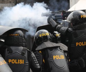 epa07590808 An Indonesian riot police officer shoots tear gas during clashes with protesters during a protest following the announcement of the presidential election results in Jakarta, Indonesia, 22 May 2019. Incumbent Indonesian President Joko Widodo was re-elected after winning the presidential election over his rival, retired General Prabowo Subianto, the election commission announced on 21 May 2019.  EPA/BAGUS INDAHONO