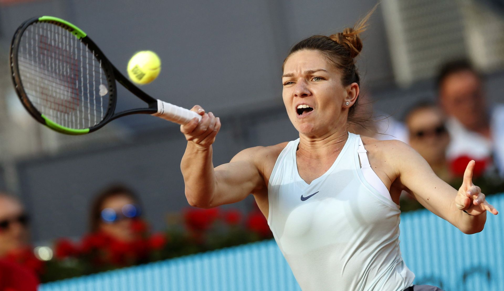 epa07562999 Simona Halep of Romania in action against Kiki Bertens of Netherlands during their Mutua Madrid Open tennis final match at Caja Magica, in Madrid, Spain, 11 May 2019.  EPA/JAVIER LIZON