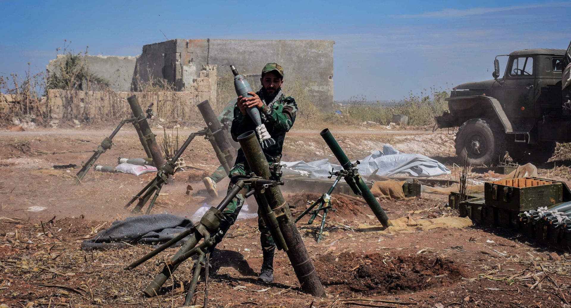 epa07563357 A handout photo made available by the Syrian Arab News Agency (SANA), shows a Syrian army soldier prepares to target terrorists' area, during an operation to liberate the village of Kafar Naboudeh, in Hama, Syria, 11 May 2019. According to SANA, the liberation of the town was achieved following precise and accurate operations targeting the terrorists' positions in the town, paving the way for expanding the secure area in Hama's northern countryside to include al-Bana, al-Arima, Tel Othman, Qalaat al-Madiq, and Bab al-Taqa.  EPA/SANA HANDOUT  HANDOUT EDITORIAL USE ONLY/NO SALES