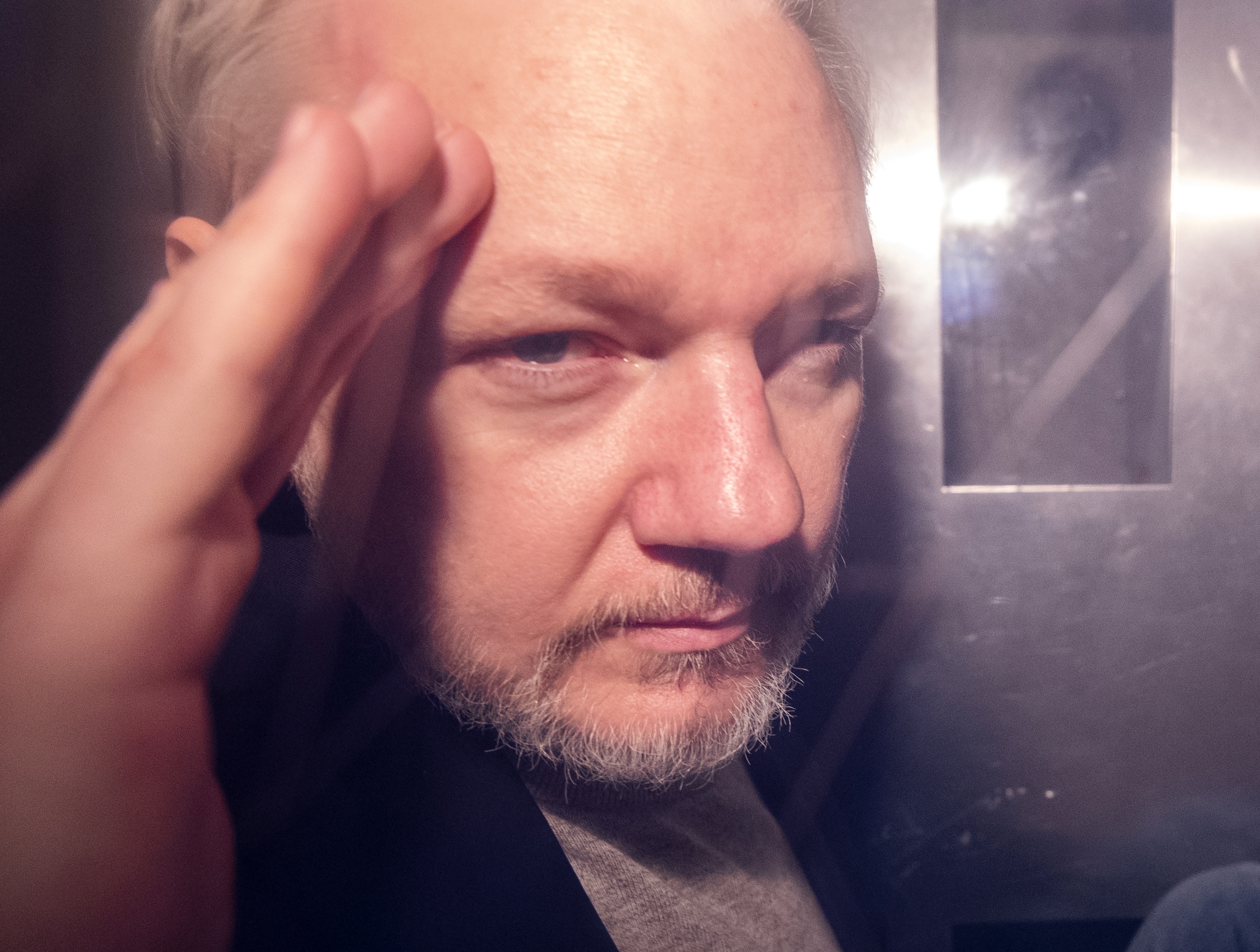 epa07566262 (FILE) - Wikileaks co-founder Julian Assange, in a prison van, as he leaves Southwark Crown Court in London, Britain, 01 May 2019, reissued 13 May 2019. Media reports on 13 May 2019 state that Swedish prosecutors are to announce whether they are reopening an inquiry into a rape allegation against Julian Assange at the request of the alleged victim's lawyer.  EPA/FACUNDO ARRIZABALAGA