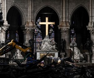 epa07572825 A picture shows rubble and the cross at the altar inside the the Notre Dame de Paris Cathedral after it sustained major fire damage the previous month, during a visit by the Canadian prime minister in Paris France, 15 May 2019. On 15 April, fire destroyed the roof and steeple of the 850-year-old Gothic cathedral. Images of the ancient cathedral going up in flames sparked shock and dismay across the globe as well as in France, where it is considered one of the nation's most beloved landmarks.  EPA/PHILIPPE LOPEZ  MAXPPP OUT