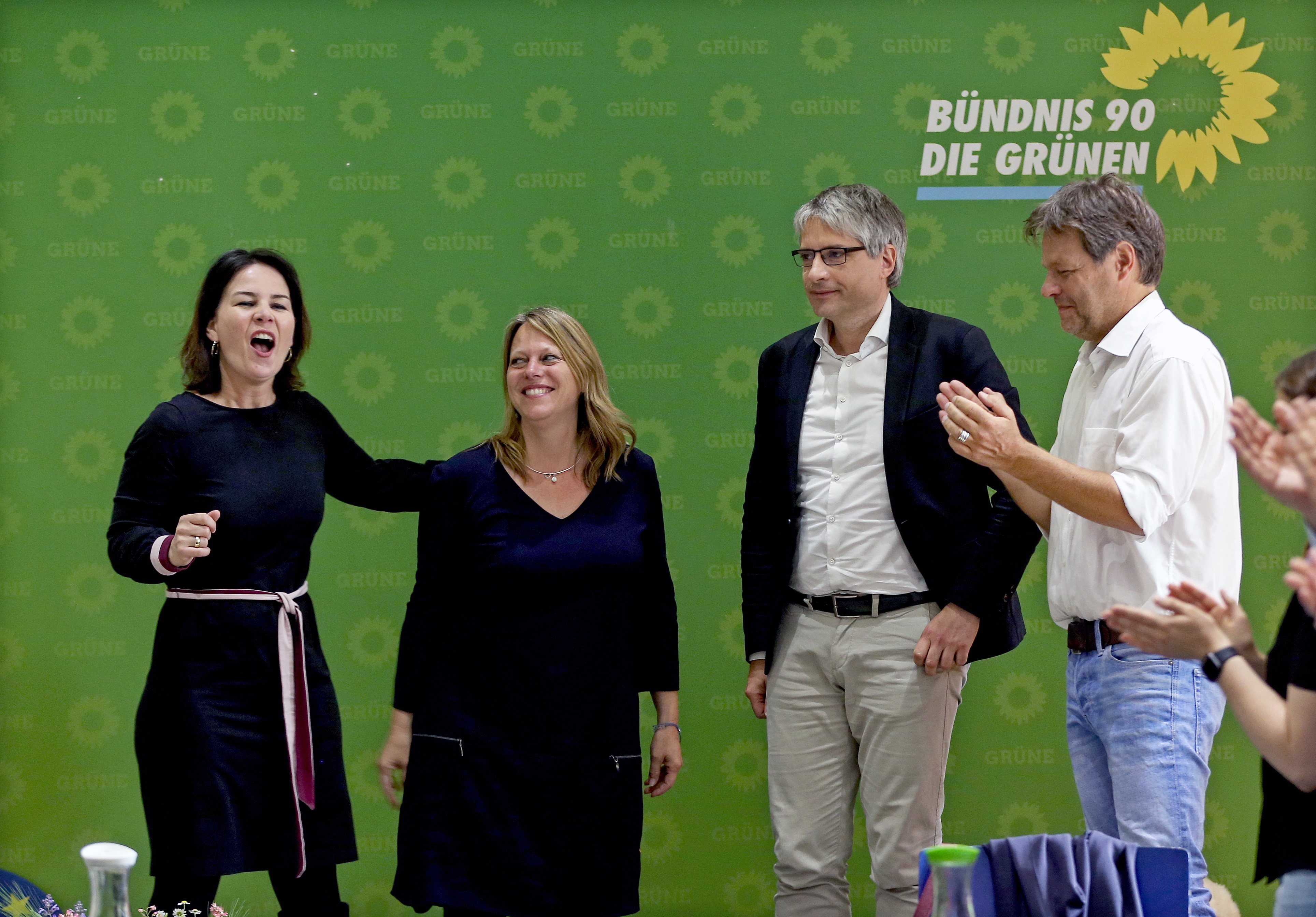 epa07605216 German top candidate of The Greens party for the European Parliament elections, Sven Giegold (2-R) and the Greens candidate for Bremen, Maine Schaefer (2-L) are congratulated by co-chairwoman Annalena Baerbock (L) and co-chairman Robert Habeck (R) as board members celebrate the European election results during a weekly meeting at the party headquarters in Berlin, Germany, 27 May 2019. The Greens experienced a raise up to 20 percent of the votes in the European elections in Germany. The European Parliament election was held by member countries of the European Union (EU) from 23 to 26 May 2019.  EPA/FELIPE TRUEBA