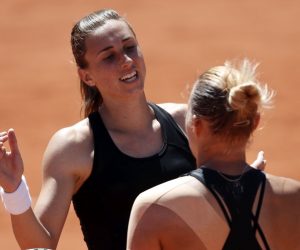 epa07619844 Petra Martic of Croatia (L) reacts after winning against Kaia Kanepi of Estonia (R) their women’s round of 16 match during the French Open tennis tournament at Roland Garros in Paris, France, 02 June 2019.  EPA/YOAN VALAT