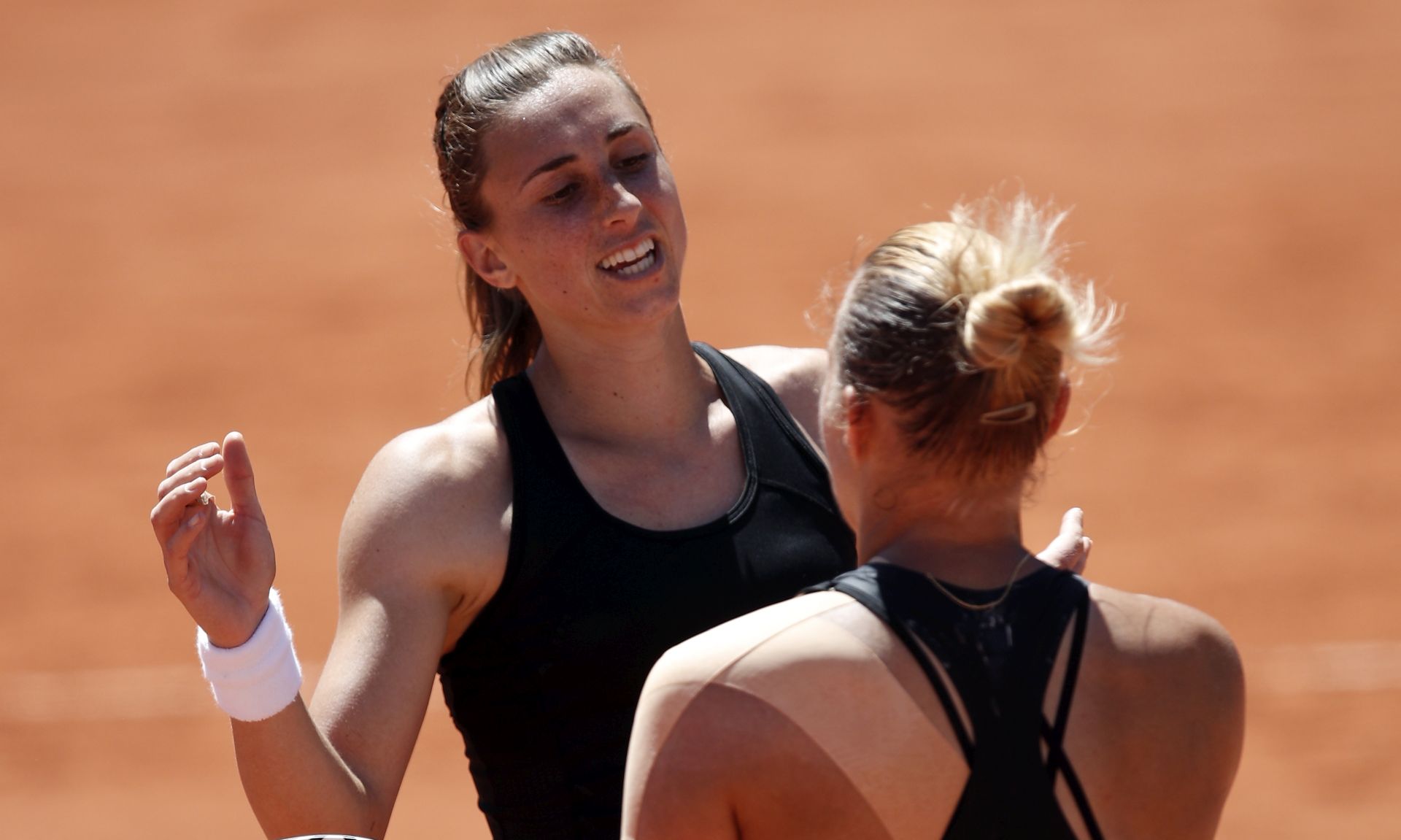 epa07619844 Petra Martic of Croatia (L) reacts after winning against Kaia Kanepi of Estonia (R) their women’s round of 16 match during the French Open tennis tournament at Roland Garros in Paris, France, 02 June 2019.  EPA/YOAN VALAT