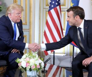 epa07630539 US President Donald J. Trump (L) and French President Emmanuel Macron (R) shake hands during a bilateral meeting on the sidelines of D-Day commemorations at the Prefecture of Caen, Normandy, France, 06 June 2019. World leaders are attending memorial events in Normandy, France to mark the 75th anniversary of the D-Day landings, which marked the beginning of the end of World War II in Europe.  EPA/LUDOVIC MARIN / POOL  MAXPPP OUT