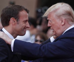 epa07630149 US President Donald Trump (R)   welcomes French President Emmanuel Macron (L) during the French - USA Commemoration marking the 75th anniversary of the Allied landings on D-Day at the Normandy American Cemetery and Memorial in Colleville-sur-Mer, France, 06 June 2019. World leaders are attending memorial events on 06 June in Normandy, France to mark the 75th anniversary of the D-Day landings, which marked the beginning of the end of World War II in Europe.  EPA/IAN LANGSDON / POOL