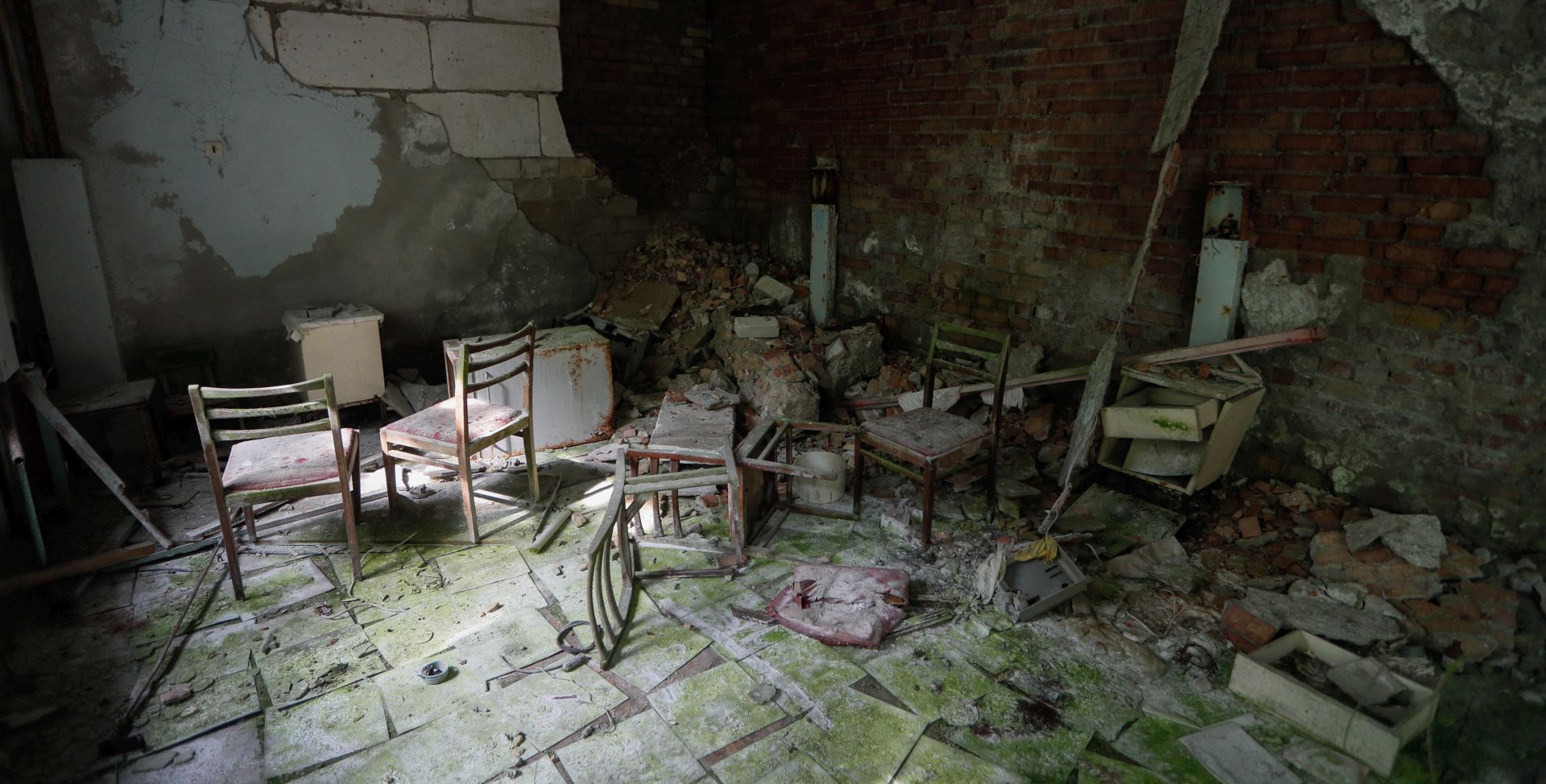 epa07633695 General view of the abandoned hospital, which received first causalities at night of accident in 1986 in the abandoned city of Pryryat, not far of Chernobyl, Ukraine, 07 June 2019. The miniseries Chernobyl (2019) made by HBO depicts the explosion`s aftermath, the vast clean-up operation and the subsequent inquiry. The success of a U.S. television miniseries examining the world`s worst nuclear accident has driven up the number of tourists wanting to see the plant and the ghostly abandoned town of Prypyat as local media report.  EPA/SERGEY DOLZHENKO
