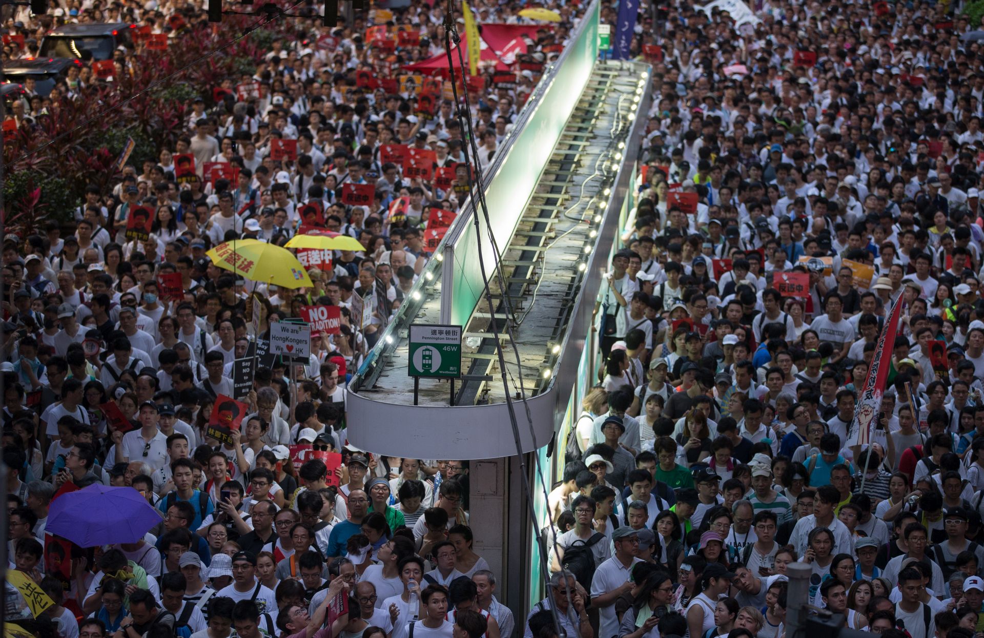 epa07636697 Thousands of protesters take part in a march against amendments to an extradition bill in Hong Kong, China, 09 June 2019. The bill, which has faced immense opposition from pan-democrats, the business sector and the international community, would allow the transfer of fugitives to jurisdictions which Hong Kong does not have a treaty with, including mainland China. Critics of the bill have expressed concern over unfair trials and a lack of human rights protection in mainland China.  EPA/JEROME FAVRE