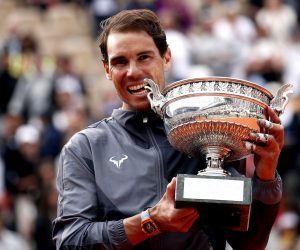epa07637363 Rafael Nadal of Spain poses with the trophy after winning the men’s final match against Dominic Thiem of Austria during the French Open tennis tournament at Roland Garros in Paris, France, 09 June 2019. Nadal won the French Open title 12th times.  EPA/YOAN VALAT