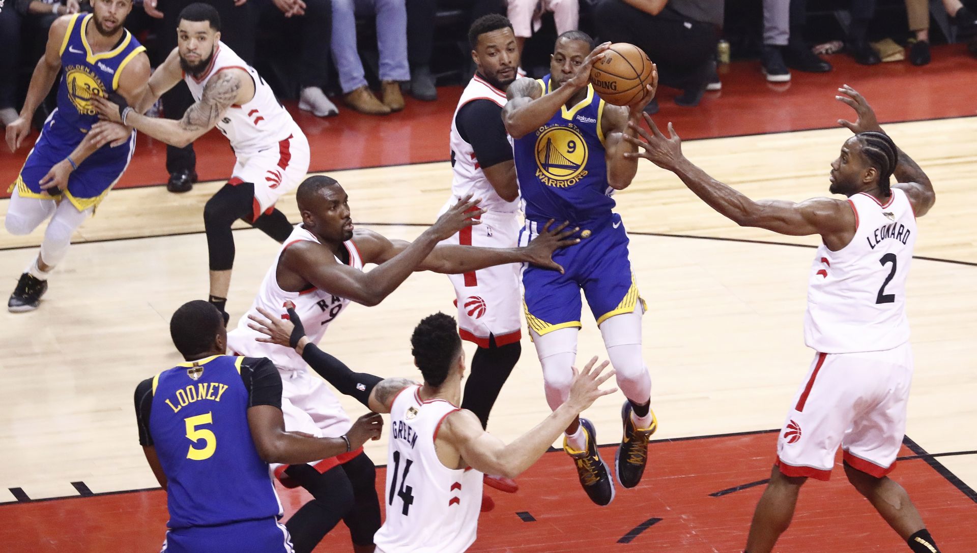 epa07640020 Golden State Warriors forward Andre Iguodala (2-R) passes off against the Toronto Raptors during the first half of the NBA Finals basketball game five between the Golden State Warriors and the Toronto Raptors at Scotiabank Arena in Toronto, Canada, 10 June 2019.  EPA/LARRY W. SMITH SHUTTERSTOCK OUT