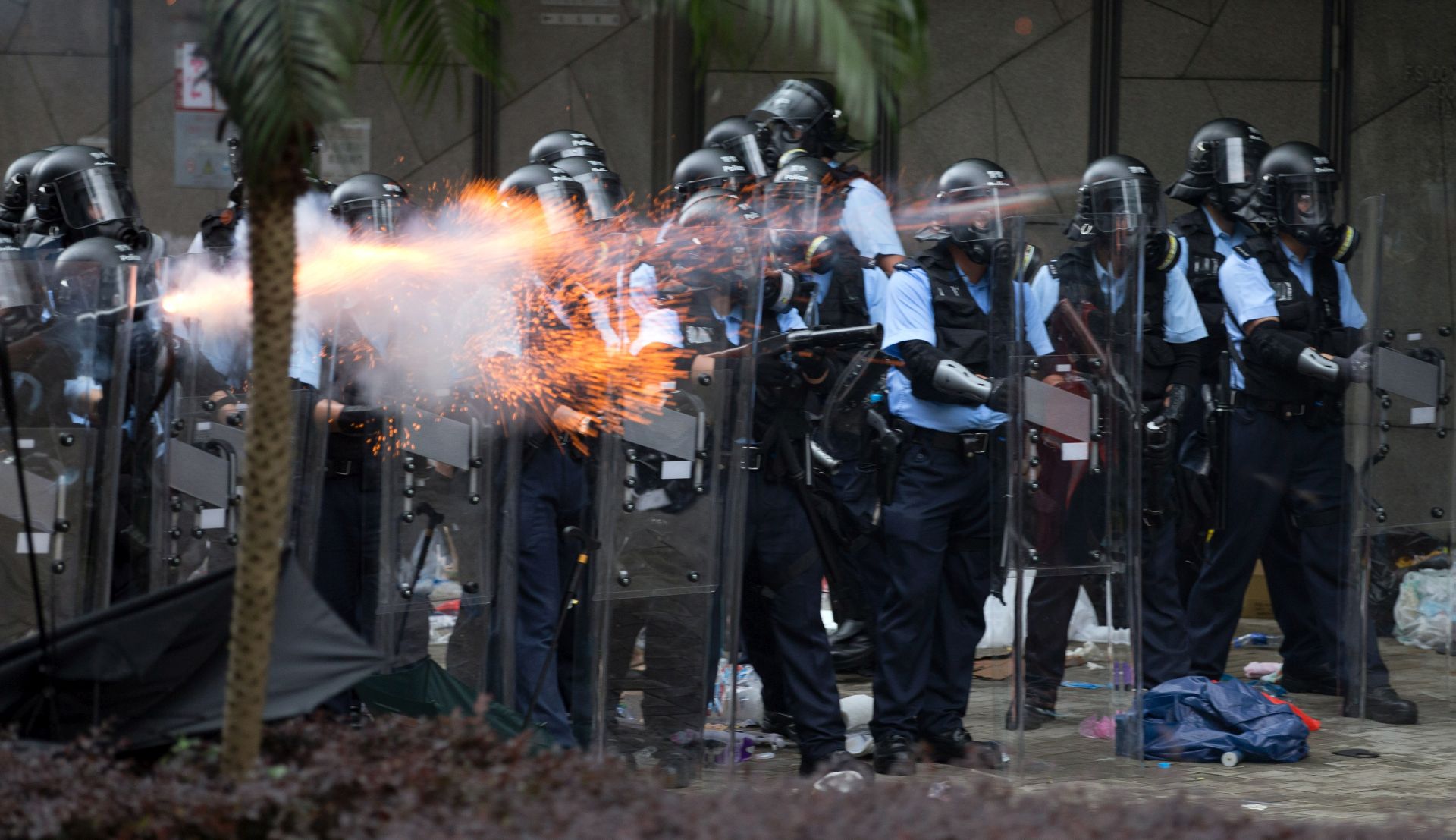 epa07643089 Police shot tear gas at protesters during a rally against an extradition bill outside the Legislative Council in Hong Kong, China, 12 June 2019. The bill has faced immense opposition from pan-democrats, the business sector, and the international community, would allow the transfer of fugitives to jurisdictions which Hong Kong does not have a treaty with, including mainland China. Critics of the bill have expressed concern over unfair trials and a lack of human rights protection in mainland China.  EPA/JEROME FAVRE