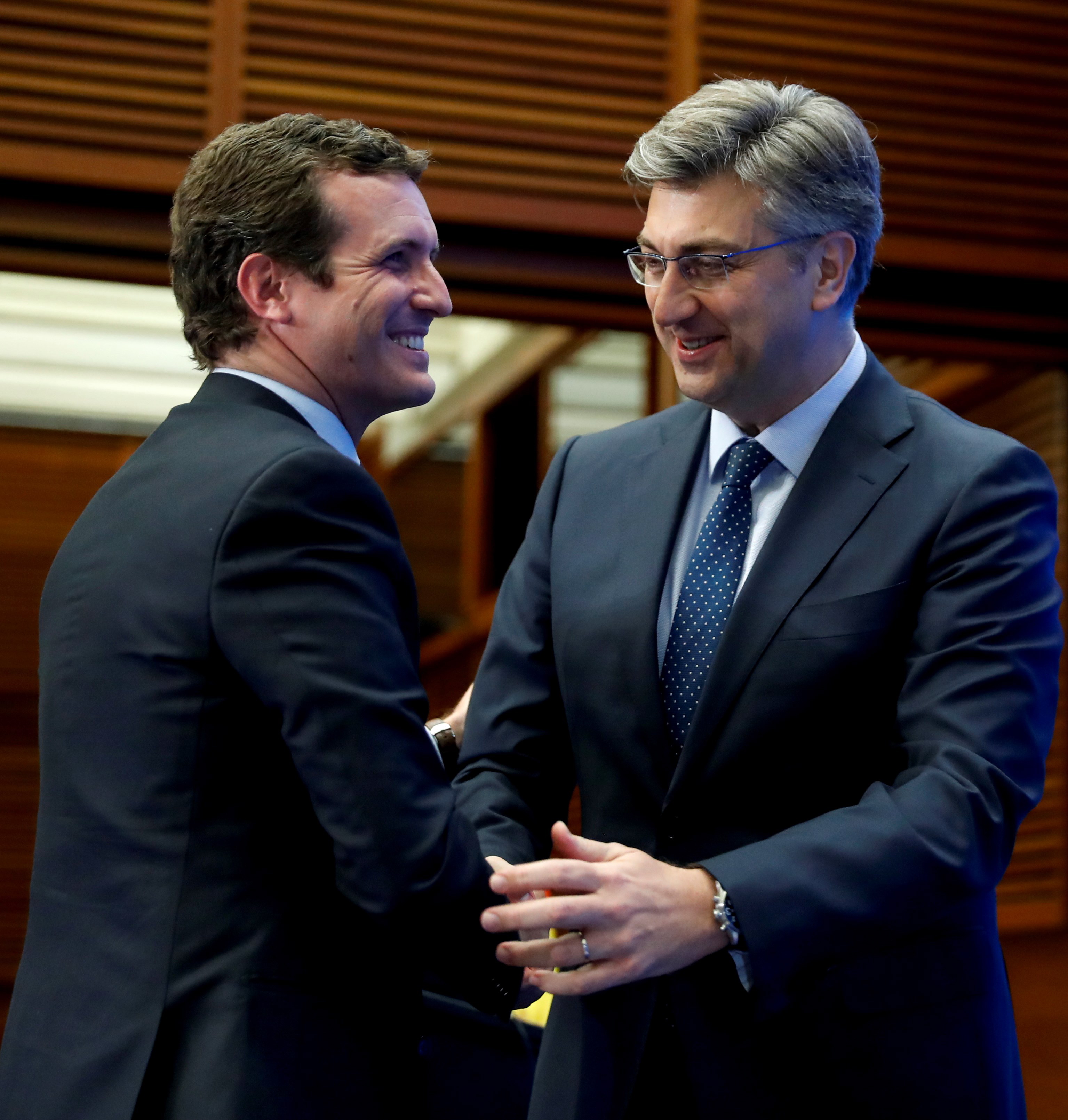 epa07643135 People's Party (PP) leader, Pablo Casado (L), greets Croatian Prime Minister, Andrej Plenkovic, as they attend the European People's Party (EPP) Group Study Days at the Kursaal Congress Palace in San Sebastian, Spain, 12 June 2019. EPP Group Study Days event takes place from 11 to 13 June.  EPA/Juan Herrero