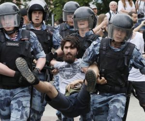 epa07643300 Russian riot police detain a participant of a protest  supporting arrested and now released Meduza's journalist Ivan Golunov suspected in drug keeping and spreading in Moscow, Russia, 12 June 2019. Ivan Golunov, a journalist specialized in corruption cases investigations was arrested by police for drug spreading and later released after a wave of public protests. Ivan Golunov denies the accusation and considers it a provocation caused by his professional activity.  EPA/YURI KOCHETKOV