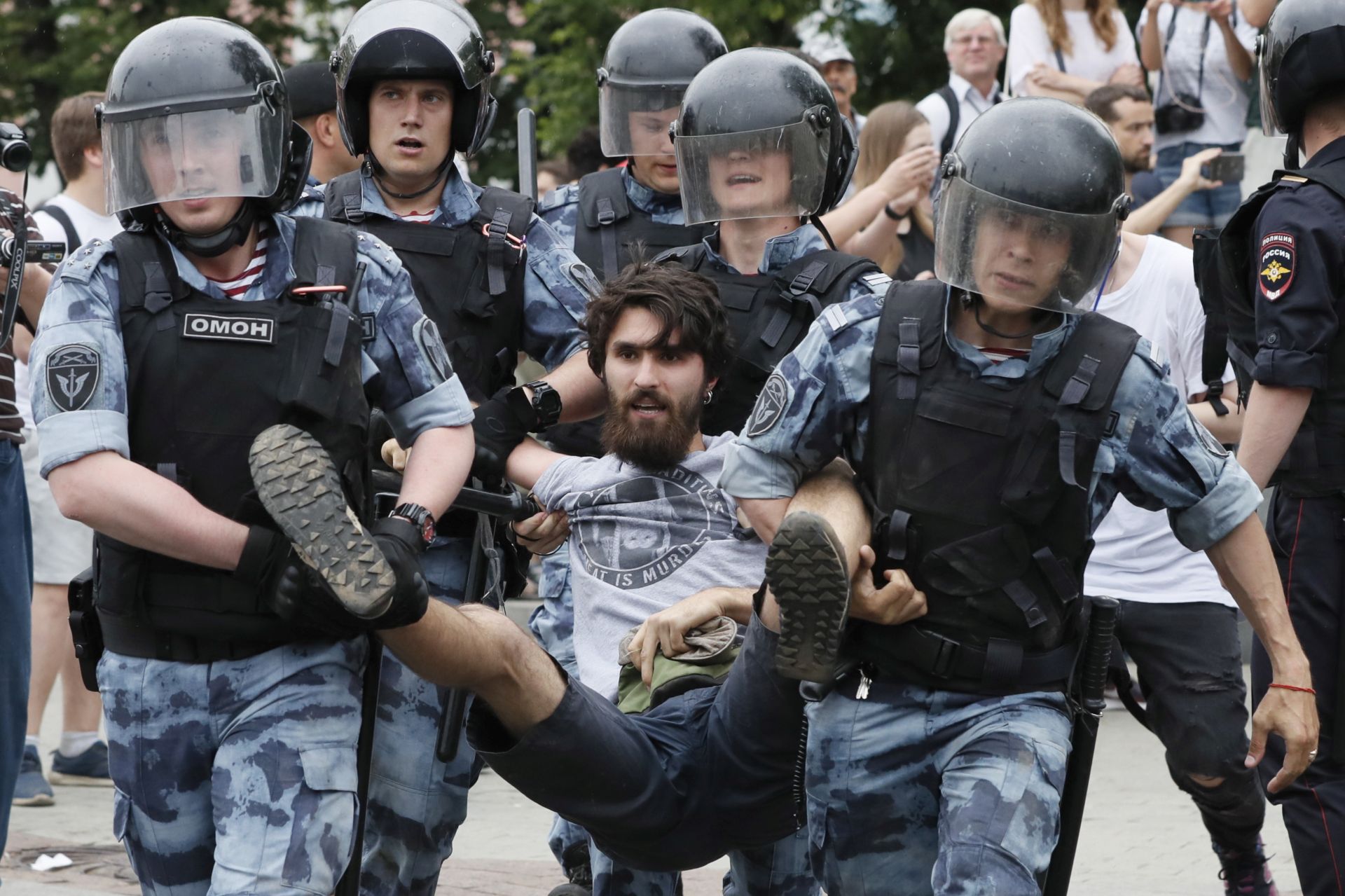 epa07643300 Russian riot police detain a participant of a protest  supporting arrested and now released Meduza's journalist Ivan Golunov suspected in drug keeping and spreading in Moscow, Russia, 12 June 2019. Ivan Golunov, a journalist specialized in corruption cases investigations was arrested by police for drug spreading and later released after a wave of public protests. Ivan Golunov denies the accusation and considers it a provocation caused by his professional activity.  EPA/YURI KOCHETKOV