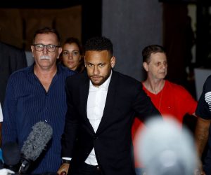 epa07646783 Brazilian soccer player Neymar Jr. (C) addresses the media as he leaves the Police Station of Women's Defense in Sao Paulo, Brazil, 13 June 2019, after questioning in a case in which he is accused of raping Brazilian model Najila Trindade.  EPA/Marcelo Chello