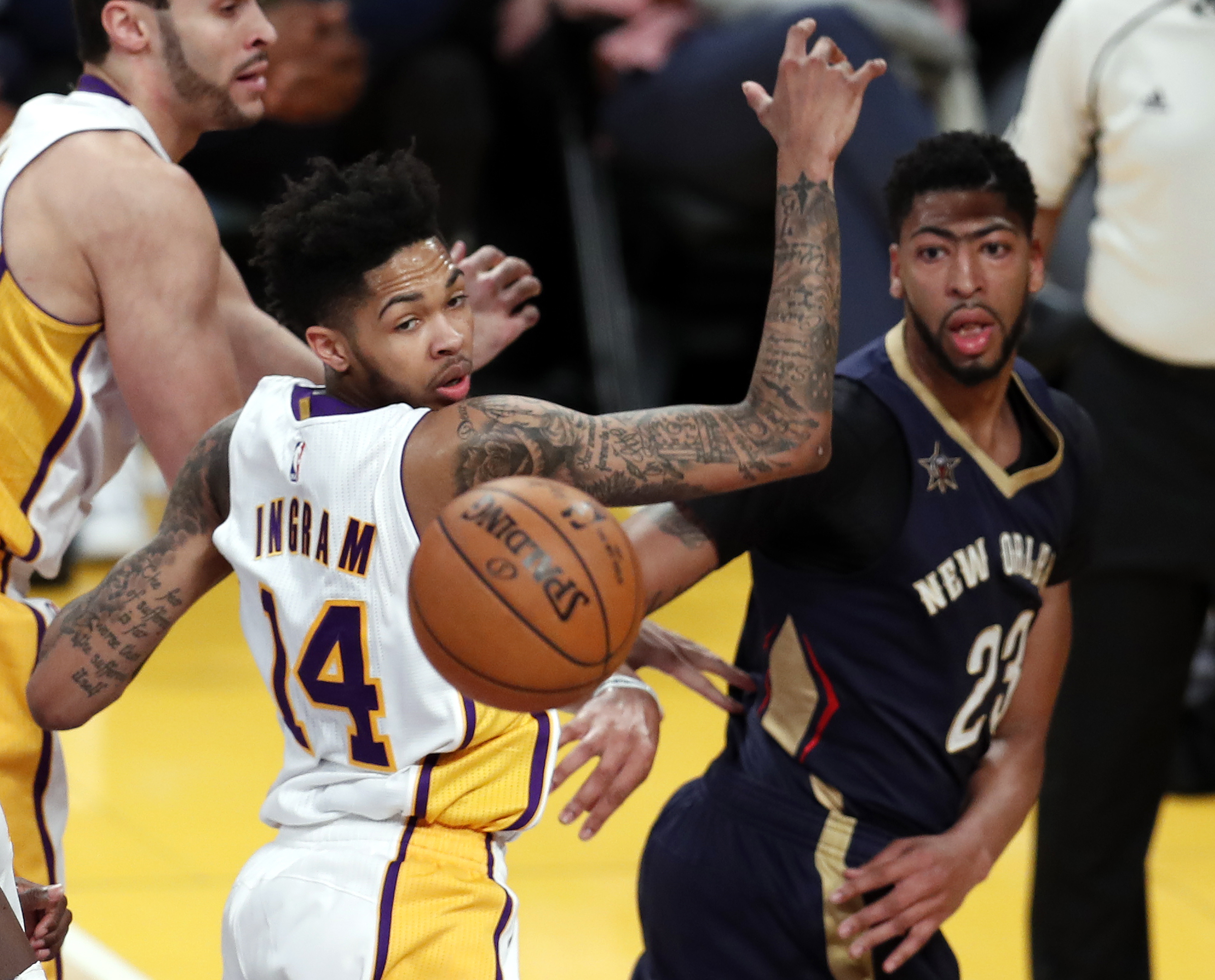 epa07650960 (FILE) - New Orleans Pelicans forward Anthony Davis (R) passes by the ball as he is defended by Los Angeles Lakers forward Brandon Ingram (L) in the first half of their NBA game at Staples Center in Los Angeles, California, USA, 05 March 2017. According to reports Davis was traded for Lonzo Ball, Brandon Ingram, Josh Hart, and three first-round picks – including the No. 4 overall in 2019 Draft.  EPA/MIKE NELSON  SHUTTERSTOCK OUT *** Local Caption *** 53371243