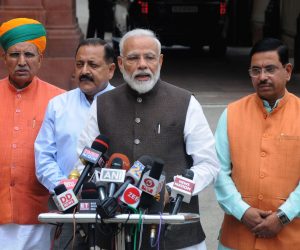 epa07653670 Indian Prime Minister Narendra Modi (2-R), addresses the media as he arrives for the first session of 17th Lok Sabha, at Parliament, in New Delhi, India, 17 June 2019. The first session of the Lok Sabha (the lower house of India's Parliament) was held in which the new lawmakers took the oath after Bharatiya Janata Party's (BJP) emphatic win in the recently held Lok Sabha elections.  EPA/STR