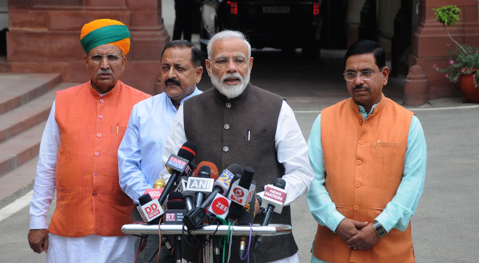 epa07653670 Indian Prime Minister Narendra Modi (2-R), addresses the media as he arrives for the first session of 17th Lok Sabha, at Parliament, in New Delhi, India, 17 June 2019. The first session of the Lok Sabha (the lower house of India's Parliament) was held in which the new lawmakers took the oath after Bharatiya Janata Party's (BJP) emphatic win in the recently held Lok Sabha elections.  EPA/STR