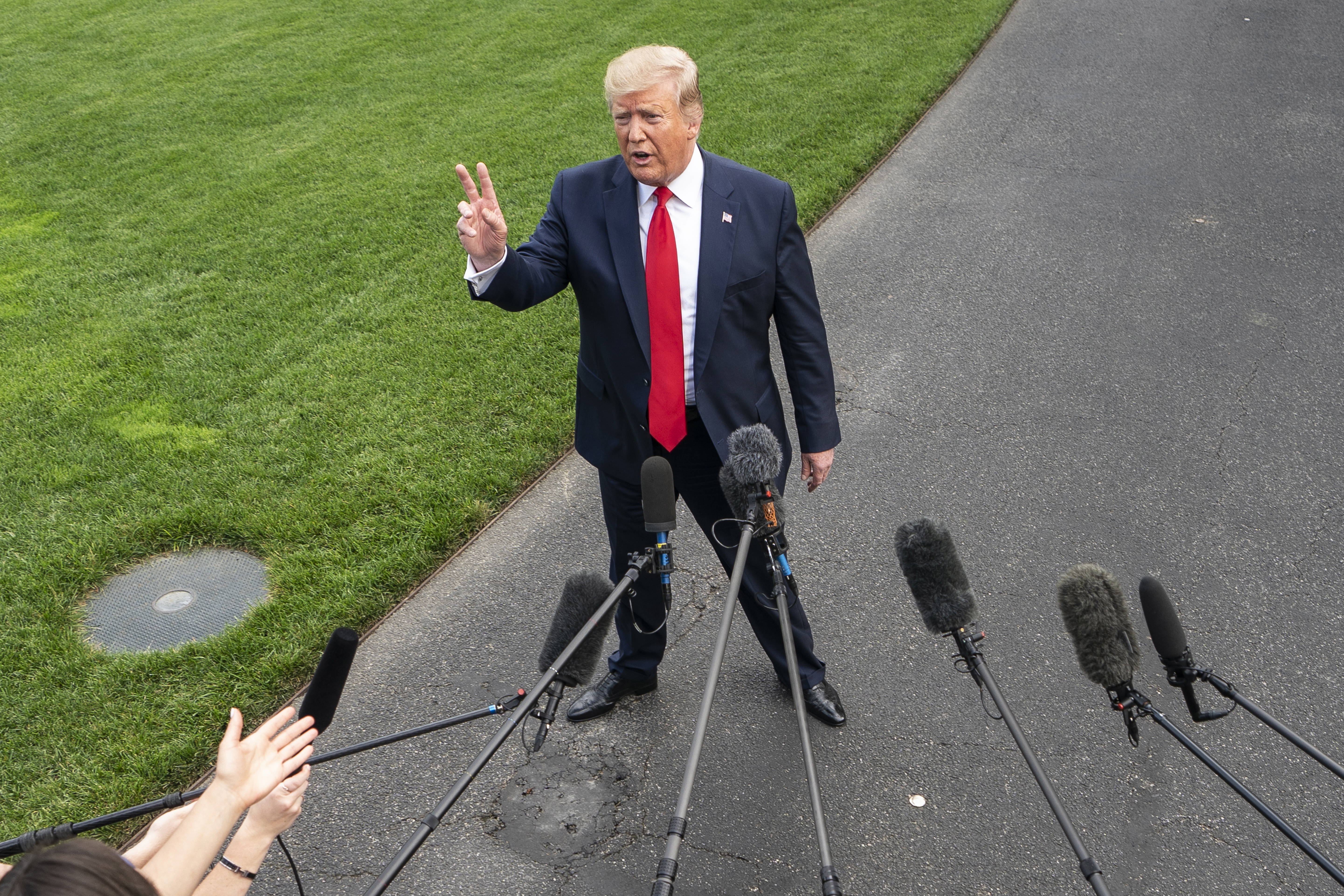 epa07656731 US President Donald J. Trump speaks to the media as he departs the White House for a campaign event in Florida in Washington, DC, USA, 18 June 2019. President Trump is travelling to Orlando to launch his 2020 re-election campaign. Prior to leaving the White House, the President spoke about Patrick Shanahan, who withdrew from consideration to be Trump's permanent defense secretary. He also spoke about tariffs, immigration, and growing tensions with Iran.  EPA/JIM LO SCALZO ALTERNATIVE CROP