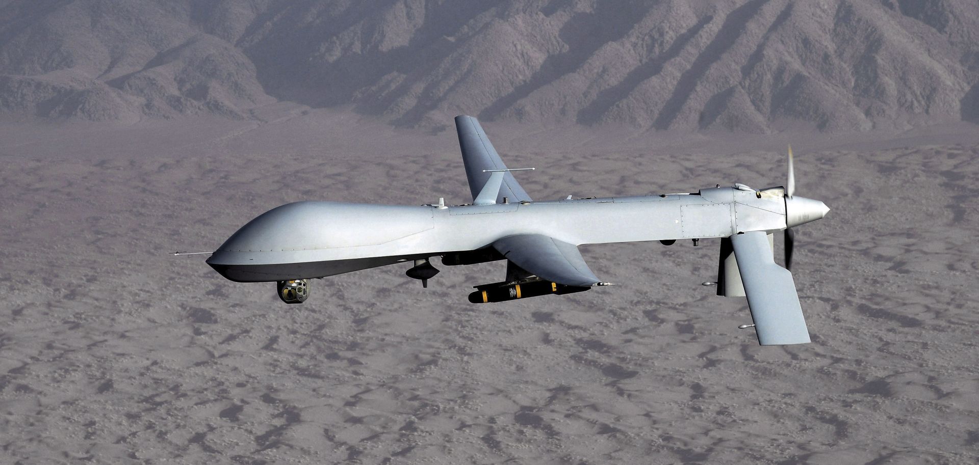 epa07659380 (FILE) - An undated handout photo made available by the US Air Force shows a MQ-1 Predator unmanned aircraft in flight at an undiclosed location, reissued 20 June 2019. Media reports on 20 June 2019 state that Iran's Islamic Revolution Guards Corps (IRGC) claim to have shot down a US spy drone over Iranian airspace, near Kuhmobarak in Iran's southern Hormozgan province. The US military has not confirmed if a drone was hit.  EPA/LT. COL. LESLIE PRATT / US AIR FORCE  / HANDOUT HANDOUT  HANDOUT EDITORIAL USE ONLY/NO SALES *** Local Caption *** 51805112