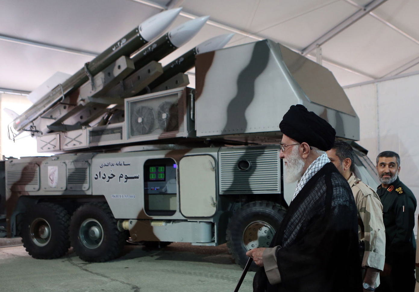 epa07662745 A handout file picture made available by Iranian Supreme Leader Office shows Iranian Supreme Leader Ali Khamenei next to Khordad-3 missile system during a revolutionary guard air force achievement exhibition in Tehran, 11 May 2014 (issued 21 June 2019). Media reported on 20 June 2019 that a US surveillance drone RQ-4A was shot down by an Iranian surface-to-air missile. Iran claims that the drone was in Iran airspace as US says the drone was flying over international water.  EPA/HO HANDOUT  HANDOUT EDITORIAL USE ONLY/NO SALES