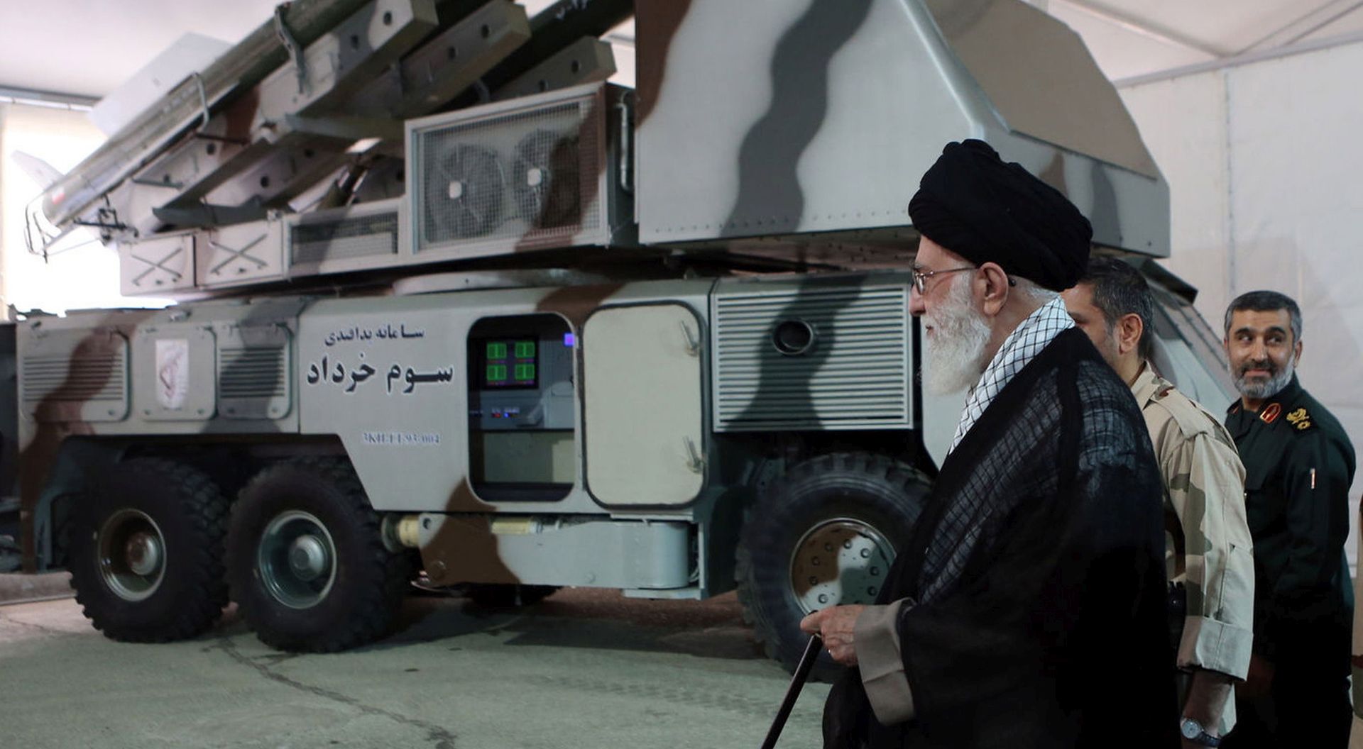 epa07662745 A handout file picture made available by Iranian Supreme Leader Office shows Iranian Supreme Leader Ali Khamenei next to Khordad-3 missile system during a revolutionary guard air force achievement exhibition in Tehran, 11 May 2014 (issued 21 June 2019). Media reported on 20 June 2019 that a US surveillance drone RQ-4A was shot down by an Iranian surface-to-air missile. Iran claims that the drone was in Iran airspace as US says the drone was flying over international water.  EPA/HO HANDOUT  HANDOUT EDITORIAL USE ONLY/NO SALES