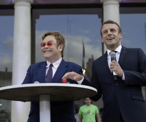 epa07664290 French President Emmanuel Macron, right, and Sir Elton John speak in the courtyard of the presidential Elysee Palace in Paris, France, 21 June 2019. Sir Elton John received the Legion of Honor, France's highest award, during a visit to the presidential Elysee Palace  EPA/Lewis Joly / POOL MAXPPP OUT