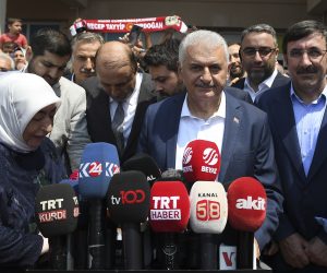epa07667752 Turkish ruling party Justice and Development Party (AKP) candidate for Istanbul mayor, Binali Yildirim (C), next to his wife Semiha Yildirim (L), speaks to the media after casting his vote in the Istanbul mayoral elections re-run, in Istanbul, Turkey, 23 June 2019. Some 10.5 million people will vote on the day in a re-run of the mayoral election. The Turkish Electoral Commission ordered a repeat of the mayoral election in Istanbul for 23 June 2019, after Turkish President Erdogan's AK Party had alleged there was 'corruption' behind his party losing in the 31 March 2019 polls.  EPA/AKIN CELIKTAS