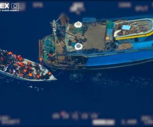 epa07669905 A screen grab taken from an undated handout video made available by the European Border and Coast Guard Agency (Frontex) on 24 June 2019 shows migrants coming out of from a fishing trawler (R) to board a wooden boat (L), at high seas in the Mediterranean. According to Frontex, some 80 people emerged from below the deck of the fishing trawler -- a so-called 'mother boat' that people smugglers use to carry large groups of migrants across the sea -- and got into the smaller boat. After the migrant boat was filled with people it slowly headed toward the Italian island of Lampedusa as the fishing trawler quickly moved away. Frontex said that it used a plane and a drone to observe the fishing trawler and the boat with migrants for several hours; it also alerted Italian and Maltese authorities and the EUNAVFOR Med (Operation Sophia). Italian authorities, who are investigating the case, started a complex operation that caught up with the bigger vessel and arrested the suspected people smugglers and the migrant boat was intercepted in the Italian waters.  EPA/FRONTEX, THE EUROPEAN BORDER AND COAST GUARD AGENCY HANDOUT  HANDOUT EDITORIAL USE ONLY/NO SALES