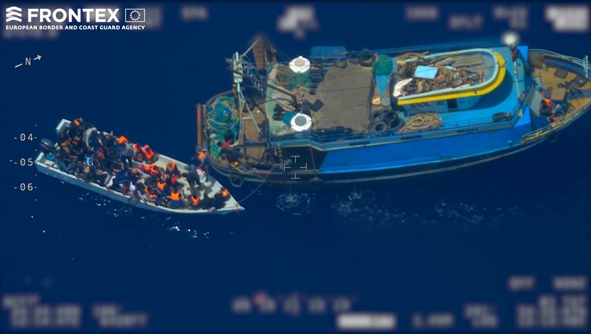 epa07669905 A screen grab taken from an undated handout video made available by the European Border and Coast Guard Agency (Frontex) on 24 June 2019 shows migrants coming out of from a fishing trawler (R) to board a wooden boat (L), at high seas in the Mediterranean. According to Frontex, some 80 people emerged from below the deck of the fishing trawler -- a so-called 'mother boat' that people smugglers use to carry large groups of migrants across the sea -- and got into the smaller boat. After the migrant boat was filled with people it slowly headed toward the Italian island of Lampedusa as the fishing trawler quickly moved away. Frontex said that it used a plane and a drone to observe the fishing trawler and the boat with migrants for several hours; it also alerted Italian and Maltese authorities and the EUNAVFOR Med (Operation Sophia). Italian authorities, who are investigating the case, started a complex operation that caught up with the bigger vessel and arrested the suspected people smugglers and the migrant boat was intercepted in the Italian waters.  EPA/FRONTEX, THE EUROPEAN BORDER AND COAST GUARD AGENCY HANDOUT  HANDOUT EDITORIAL USE ONLY/NO SALES