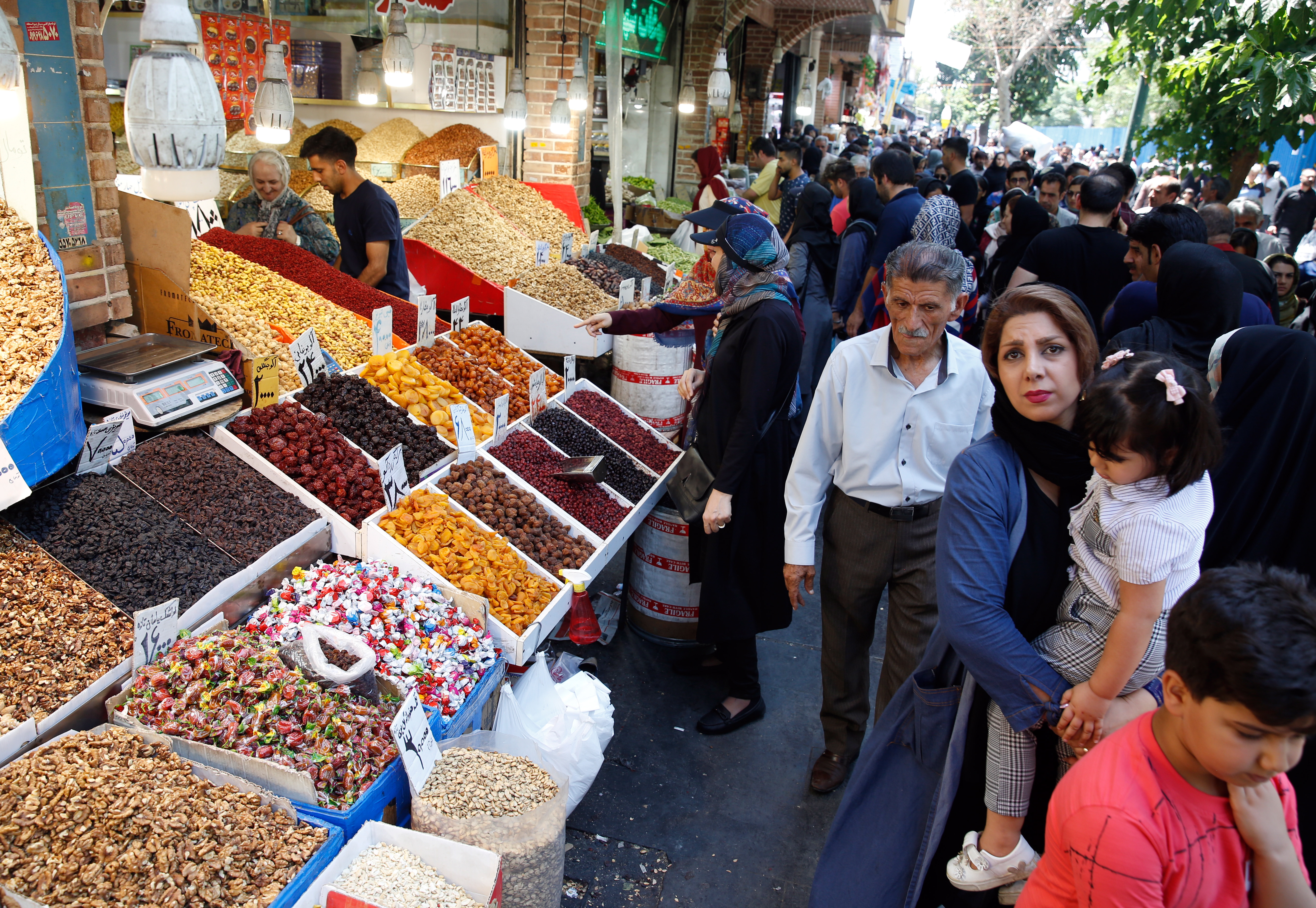 epa07670600 An Iranian woman looks at dry goods displayed at old grand bazaar in Tehran, Iran, 24 June 2019. Iranian media has reported that as Iranians suffer from the sanctions and economic crisis which has affected their lives, US administration is to announce further sanctions against Iran in coming hours. The new sanctions are coming after a US drone was shot down by Iranian forces on 20 January 2019.  EPA/ABEDIN TAHERKENAREH