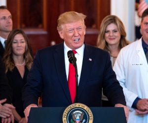 epa07671515 US President Donald J. Trump (C) speaks alongside medical professionals and patients before signing the 'Improving Price and Quality Transparency in American Healthcare to Put Patients First' executive order, at the White House in Washington, D.C., USA, 24 June 2019. The executive order directs to improve transparency in healthcare billing in order for patients to know what they will be billed before a procedure or treatment.  EPA/KEVIN DIETSCH / POOL