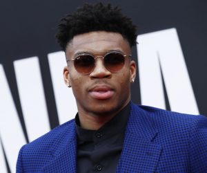 epa07671929 Greek basketball player Giannis Antetokounmpo poses for photographers upon his arrival for the 2019 NBA Awards at Barker Hangar in Santa Monica, California, USA, 24 June 2019. The 2019 NBA Awards will be the 3rd annual awards show by the National Basketball Association (NBA).  EPA/ETIENNE LAURENT