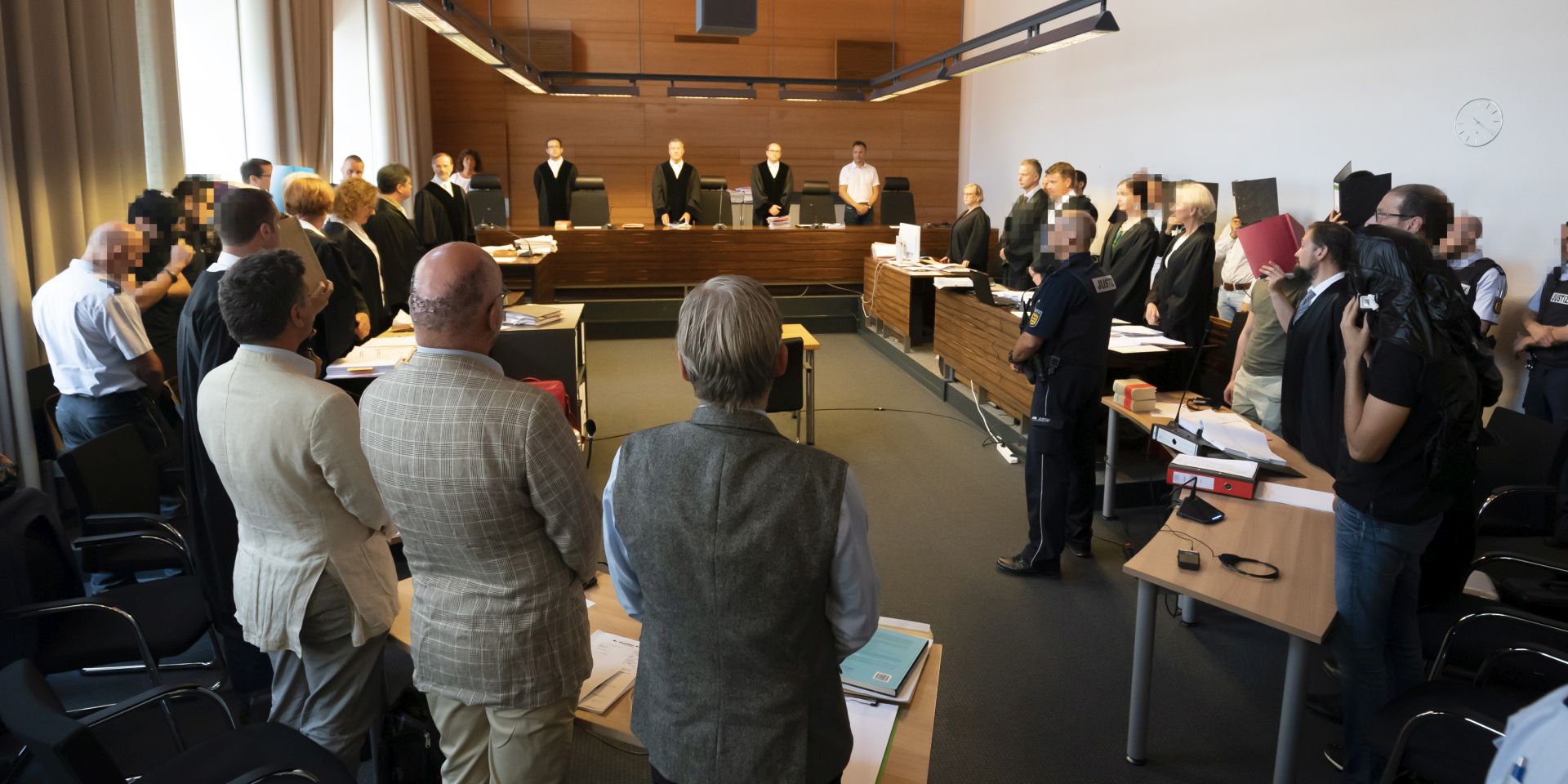 epa07673988 The court during the trial of eleven defendants into the alleged gang rape of an 18-year-old woman, at the regional court's special chamber for juveniles in Freiburg, Germany, 26 June 2019. The public prosecutor's office alleges that Ahmed Al. H. and ten other defendants, are suspected of gang raping a then 18-year-old student on 14 October 2014 outside a techno event at the Hans-Bunte-Areal in Freiburg, southern Germany. According to reports, the accused are eight Syrians, mostly refugees, aged between 19 and 30, an Iraqi, an Algerian and a man with German citizenship.  EPA/RONALD WITTEK ATTENTION EDITORS: IMAGE PIXELATED ACCORDING TO COURT ORDER