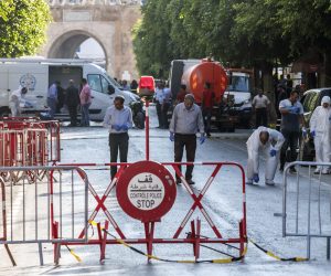 epa07678163 Police and emergency workers at the scene after a suicide bombing targeted a police vehicle in Tunis, Tunisia, 27 June 2019. According to media reports, two suicide bomb attacks near the French embassy and in the main street in the city of Tunis targeted a police patrol cars, both areas close to the shopping center, which was targeted by a female suicide bomber last October 2018. At least two people were killed and multiple others injured.  EPA/STRINGER
